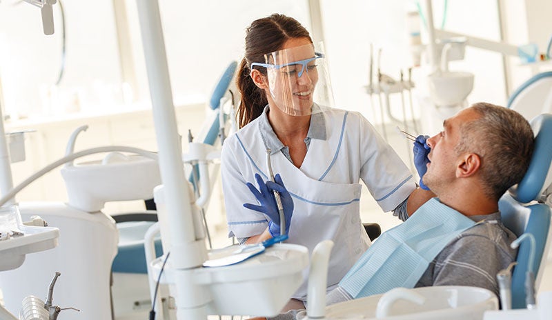 Dentist with patient