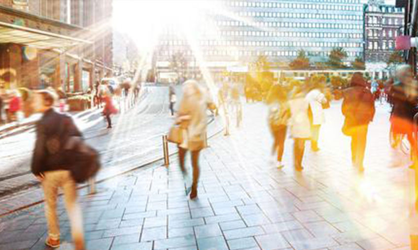 Busy city block with people walking